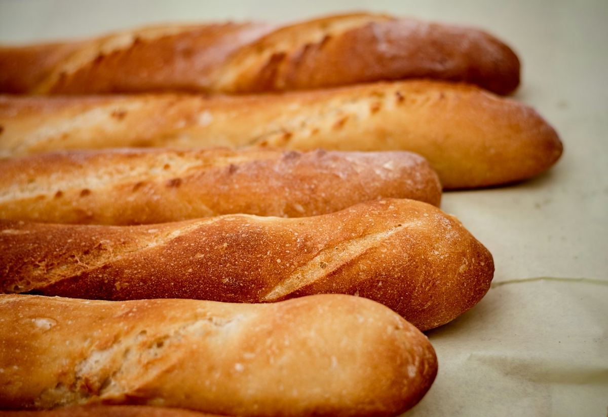 A row of freshly baked baguettes.